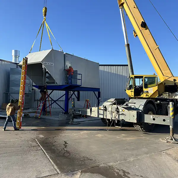 Titan Mechanical installing an industrial AC Unit.