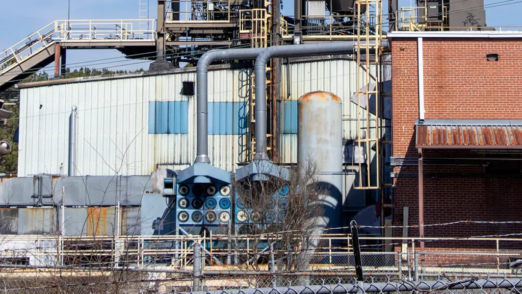 Dust collection system to help purify the air of this production facility.  Notice the two large air purification fans for dust control.