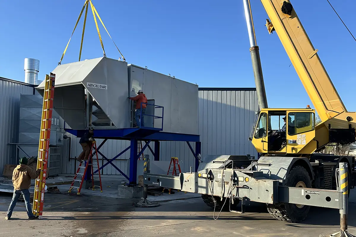 Titan Mechanical working on an efficient air exchanger upgrade to a local metal fabrication shop.